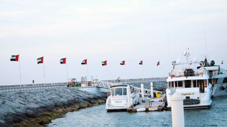 DUBAI, UNITED ARAB EMIRATES, UAE - NOVEMBER 20, 2017: marina near the Hotel Burj al Arab, there are many beautiful moored yachts. High quality photoのeditorial素材