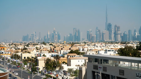 DUBAI, UNITED ARAB EMIRATES, UAE - NOVEMBER 20, 2017: city district near Hotel Jumeirah Al Qasr, small buildings, far away skyscrapers. High quality photoのeditorial素材