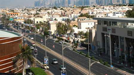 DUBAI, UNITED ARAB EMIRATES, UAE - NOVEMBER 20, 2017: Traffic moves along a busy city road in afternoon. A view from above. motorway through the city. High quality photoのeditorial素材