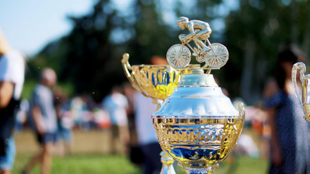 close-up, beautiful gold and silver cups, awards for outdoor cycling competition. High quality photoの写真素材