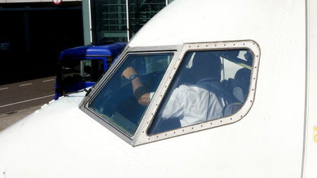 Ukraine International Airlines. the pilot in the cockpit in the plane. preparing for the next...