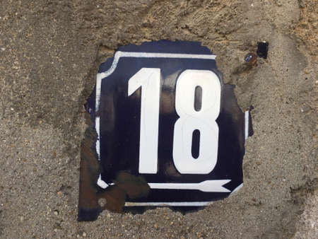 Vintage grunge square metal rusty plate of number of street addressの素材