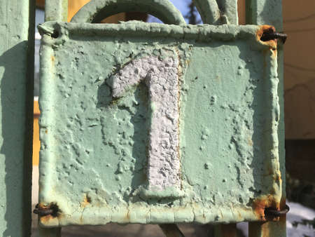 Vintage grunge square metal rusty plate of number of street addressの素材