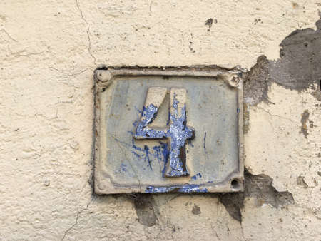 Vintage grunge square metal rusty plate of number of street address