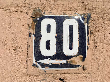 Vintage grunge square metal rusty plate of number of street addressの素材