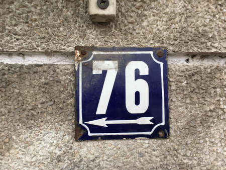 Vintage grunge square metal rusty plate of number of street address