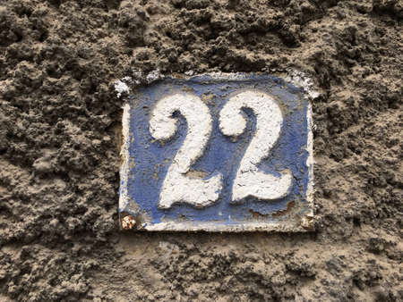 Vintage grunge square metal rusty plate of number of street addressの素材
