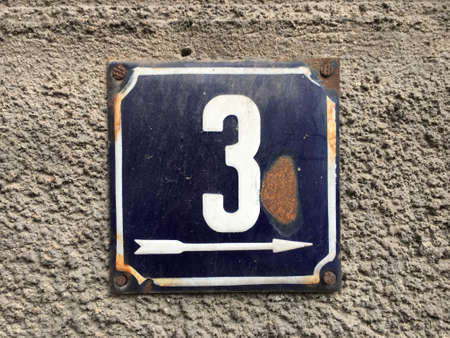 Vintage grunge square metal rusty plate of number of street addressの素材