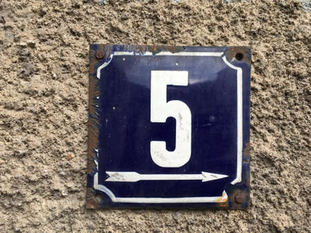 Vintage grunge square metal rusty plate of number of street addressの素材