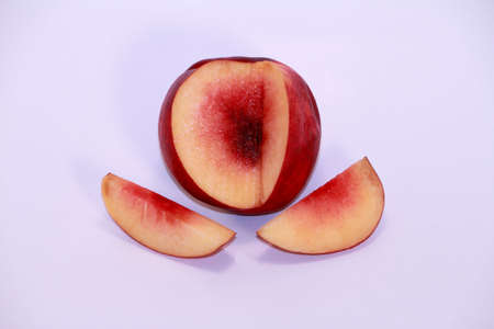 Sweet and juicy nectarines sliced and  isolated on white.の写真素材