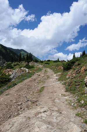Colorful mountains with road, sky and cloudsの写真素材