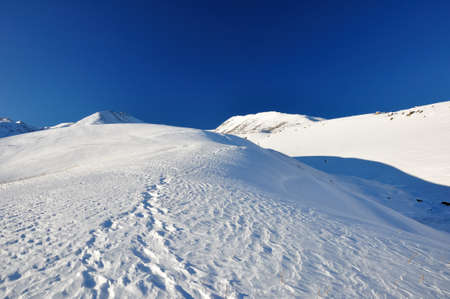 Winter, mountains in snow and blue skyの写真素材