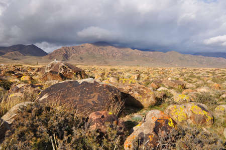 Ancient petroglyphs in a Valley Stones on Issyk-Kul, Kyrgyzstanの写真素材