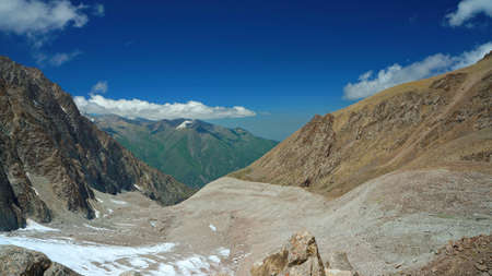 Mountain valley with the dark blue sky, Kyrgyz Mountainsの写真素材