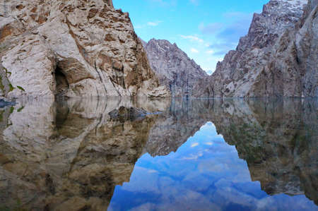 Surprising rocks are reflected in high-mountainous  lake and excellent colour of the sky - Kelsu, Kyrgyzstanの写真素材