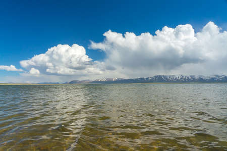 Surprisingly beautiful Son-Kul lake with blue sky and stunned cloudsの写真素材
