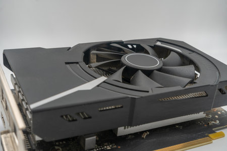 Detailed view of advanced gpu technology. focus on cooling fan, heat sink, and circuit board. essential for pc gaming, video editing, and cryptocurrency mining. crucial componentの写真素材