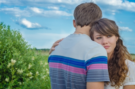 Young loving couple embracing  and smilingの写真素材
