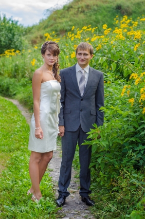 Bride and groom on the roadの写真素材