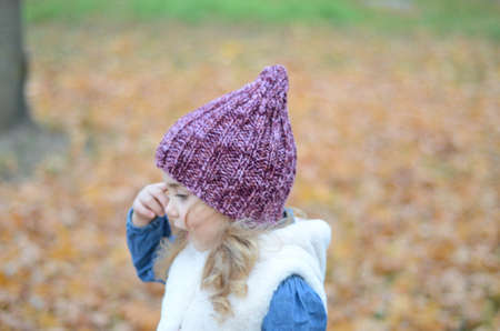 Picture of a blonde toddler girl in the funny knitted hatの写真素材