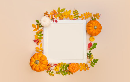 Creative Top view flat lay autumn composition white frame. Pumpkins dried orange flowers leaves background copy space Template golden frame mock up fall harvest thanksgiving halloween anniversaryの写真素材