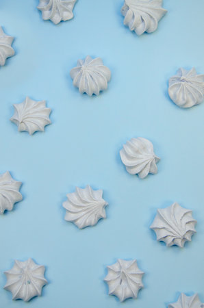 Top view marshmallow texture monocolored mocup, colorful french macaron cookie template. White french zephyr on blue background Cover packaging patern for wedding holiday Valentine's Dayの写真素材