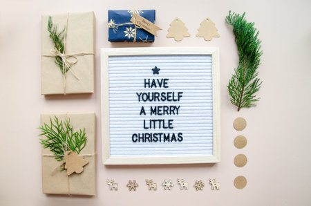Christmas flatlay letter board spelling Have yourself a merry little Christmas with decorations and wrapped gifts. Holiday card, Christmas greetings concept.の写真素材