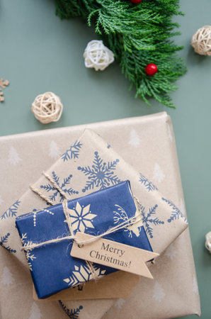Christmas zero waste, environmentally friendly gift wrapping craft paper fir branches, Christmas Eve, ecological concept of eco-friendly banner decorの写真素材