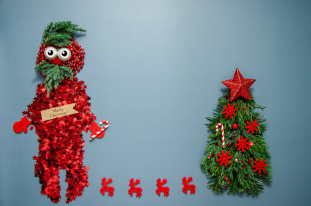 New Year and Christmas concept. Santa Claus hipster made of glitter confetti and fir branches with deers and Christmas tree. Copy space. Card design, invitation, kids party template.の写真素材