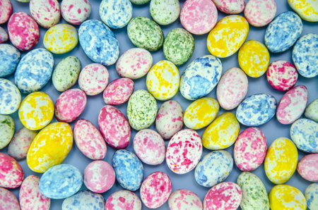 Small multicolored Easter eggs. Spring background. View from above. Flat lay.の写真素材