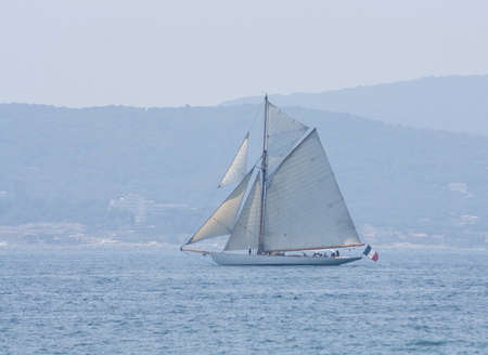 Sailing in the sun fore the shore of the french rivieraの写真素材