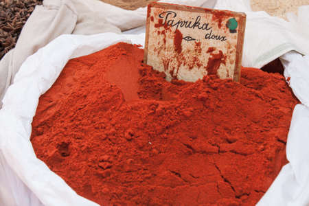Paprika powder in a big bag on a marketの写真素材