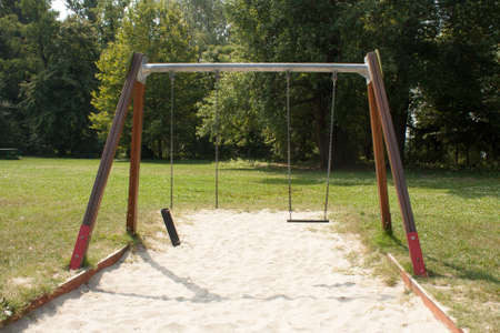 abandoned broken swingの写真素材