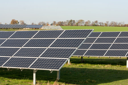 Solar panels on a field, collecting energy in the sunの写真素材