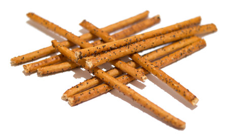 Bread sticks with poppy seeds isolated on white background