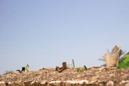 Glass of broken bottles on top the wall.の写真素材