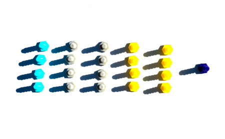 A squad of plastic multicolored cogs casting a shadow isolated on a white background.