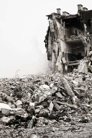 Destroyed building, can be used as demolition, earthquake, bomb, terrorist attack or natural disaster concept. Noise addedの写真素材