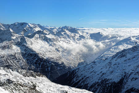 Scenic view of Austrian Alps covered with clouds.の写真素材