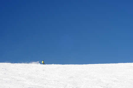 Skier having fun on wide slopes of Austrian glacier in Solden.の写真素材
