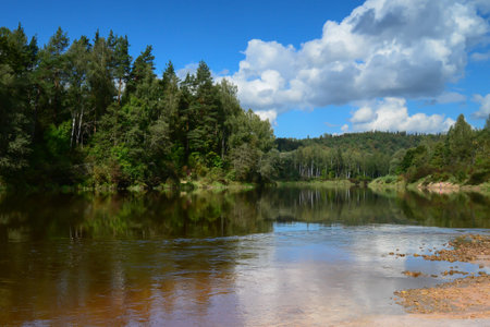 river and passing clouds