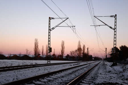 Railroad platform over sunsetの写真素材