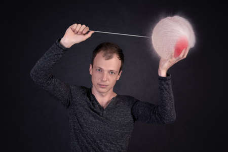 man blowing a water balloonの写真素材