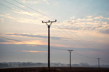 sunrise sky over power lines at Tatrasの写真素材