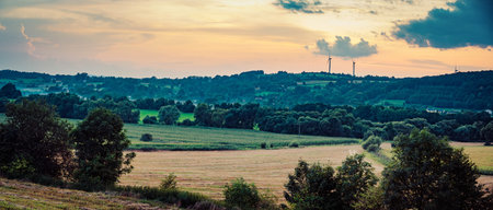 Wind turbines on sunset background, Romaniaの写真素材