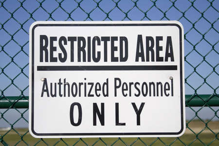 Restricted Area - Authorized Personnel Only -- sign posted outside of an airport.の写真素材