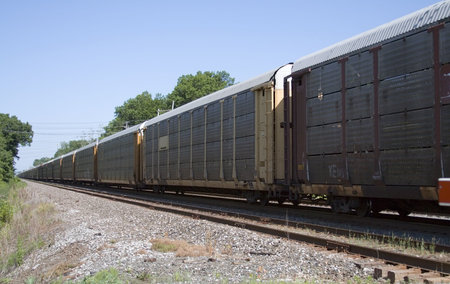 View of a railroad train on a bright day.