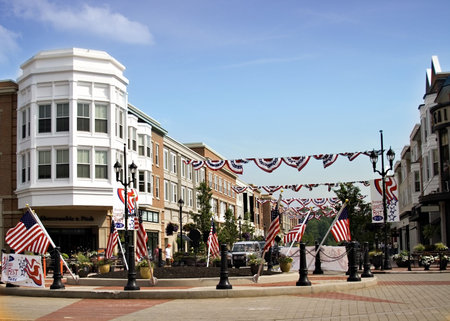 Suburban residential and commercial area decorated for the fourth 4th of July.  Banners and flags displayed.の写真素材