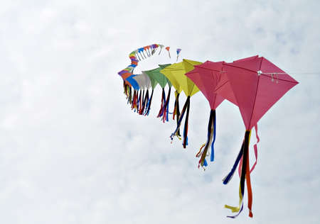Several kites flying on a single lead - poetry in motion.の写真素材