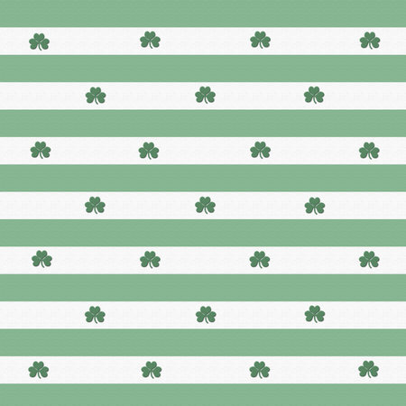 A textured green and white striped background with shamrocks.  Perfect for your St. Patty's day layouts.の写真素材